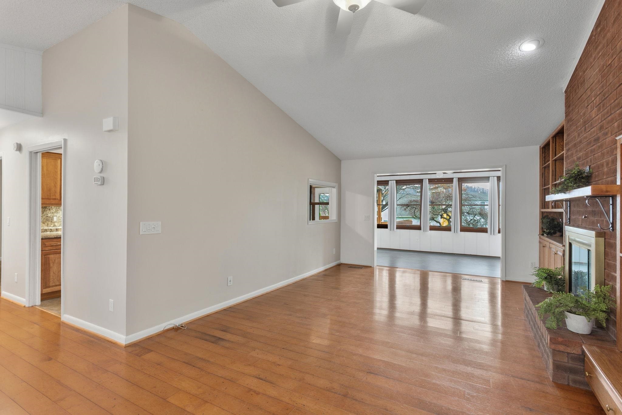 3210 Arrowhead Road Harrisonburg, VA 22801 - Photo 9 of 44 an empty room with wooden floor and windows