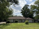 a view of house with garden
