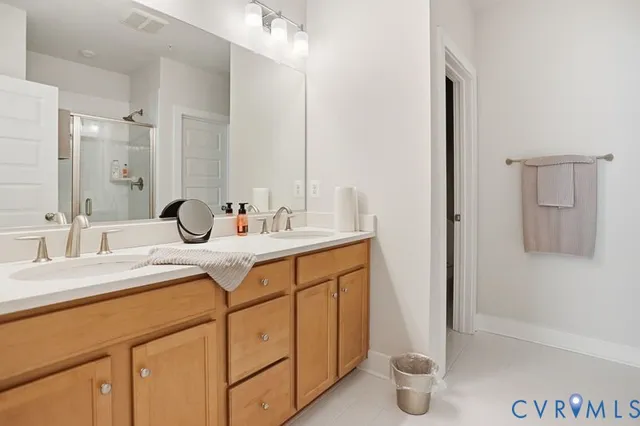 a bathroom with a glass shower door