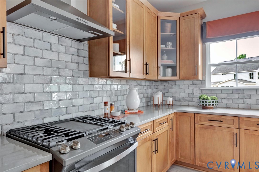 967 Charlemagne Road Midlothian, VA 23114 - Photo 12 of 50 a kitchen with granite countertop a stove sink and cabinets