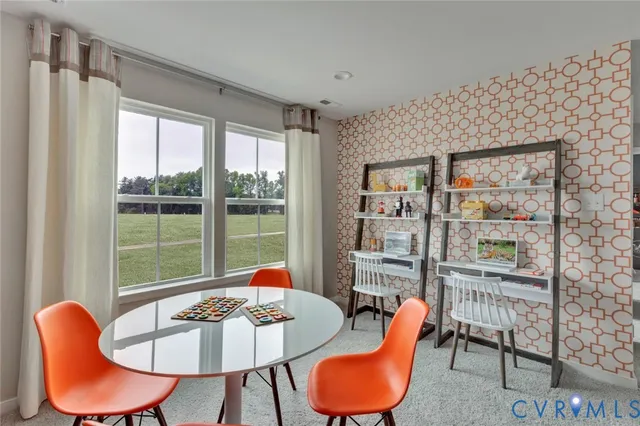 a spacious bedroom with a bed and a couch