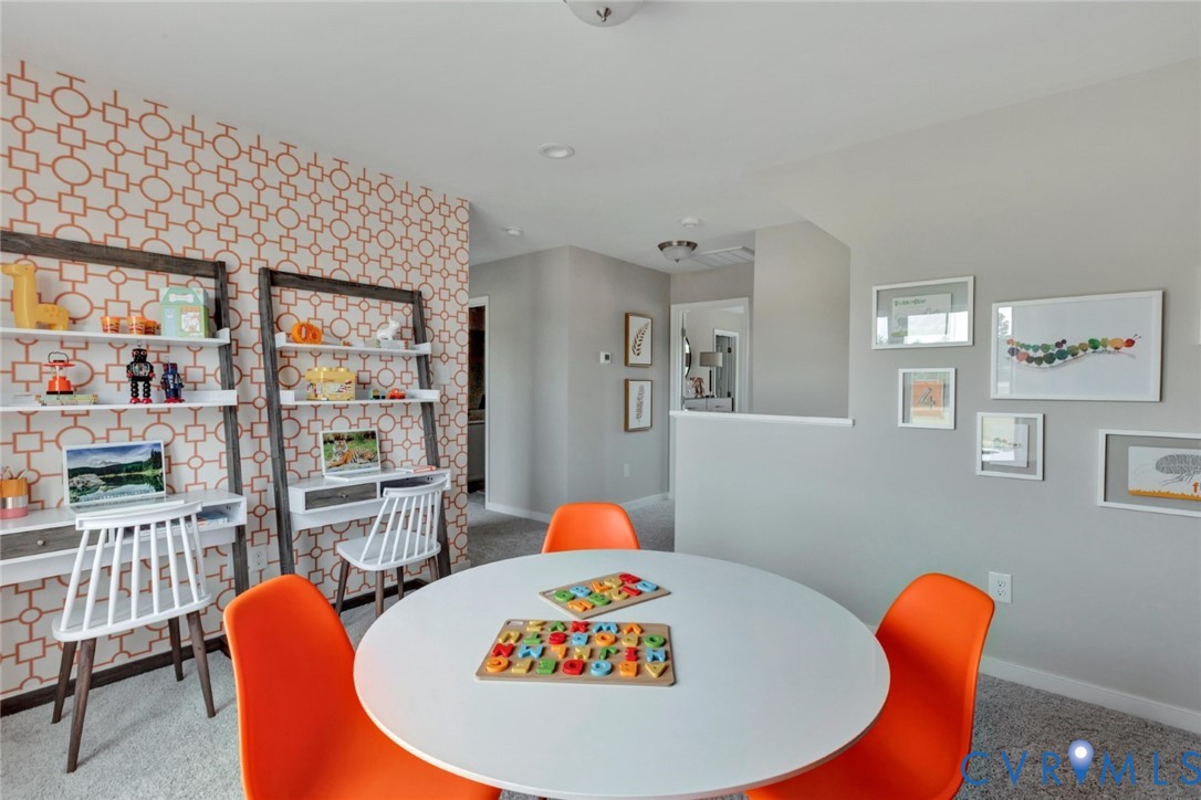 967 Charlemagne Road Midlothian, VA 23114 - Photo 20 of 50 a living room with furniture a rug and a table