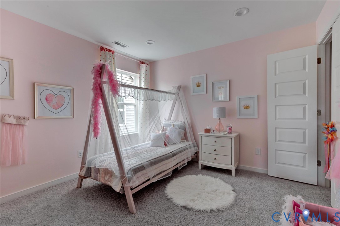 967 Charlemagne Road Midlothian, VA 23114 - Photo 26 of 50 a bedroom with a bed and a baby