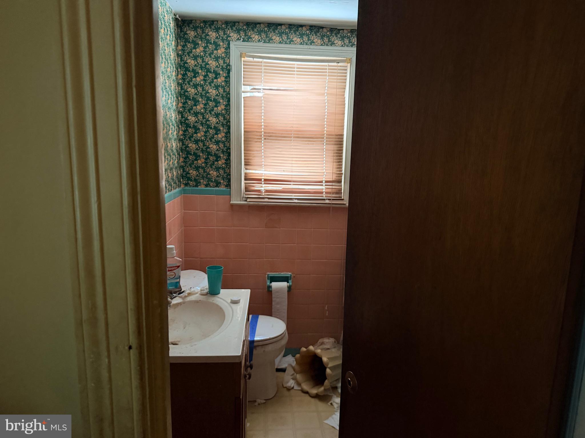 132 Oakdale Road Cherry Hill, NJ 08034 - Photo 13 of 18 a bathroom with a sink a toilet and a mirror