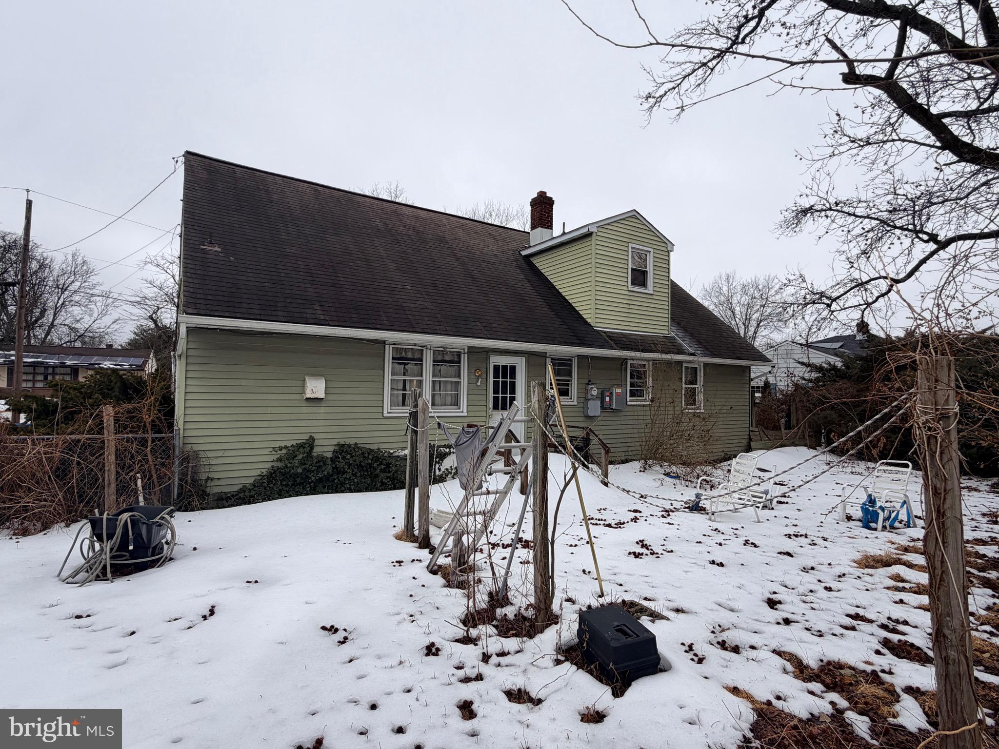 132 Oakdale Road Cherry Hill, NJ 08034 - Photo 2 of 18 a view of a wooden house with snow on the road