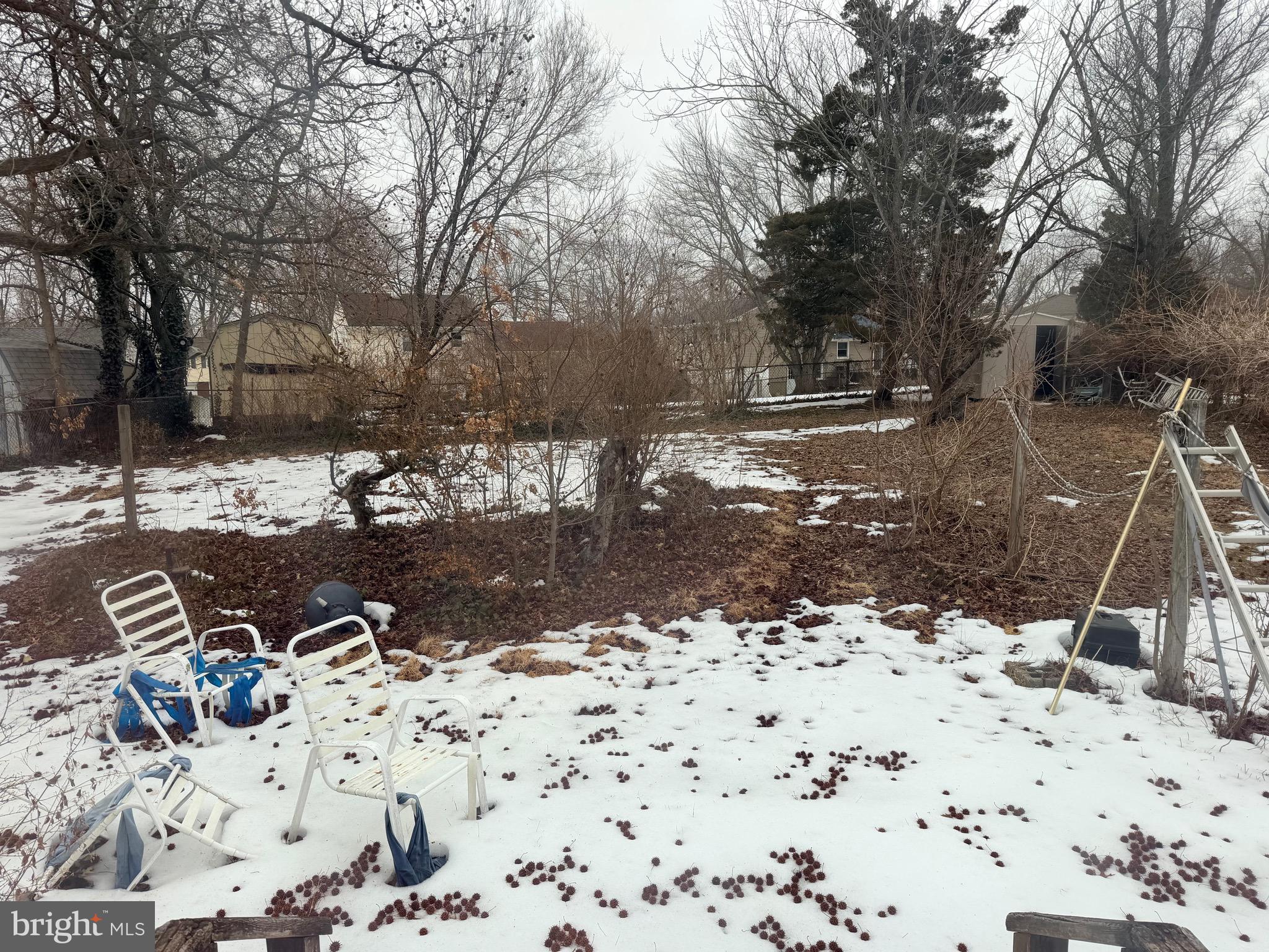 132 Oakdale Road Cherry Hill, NJ 08034 - Photo 3 of 18 a view of a backyard with snow on the road