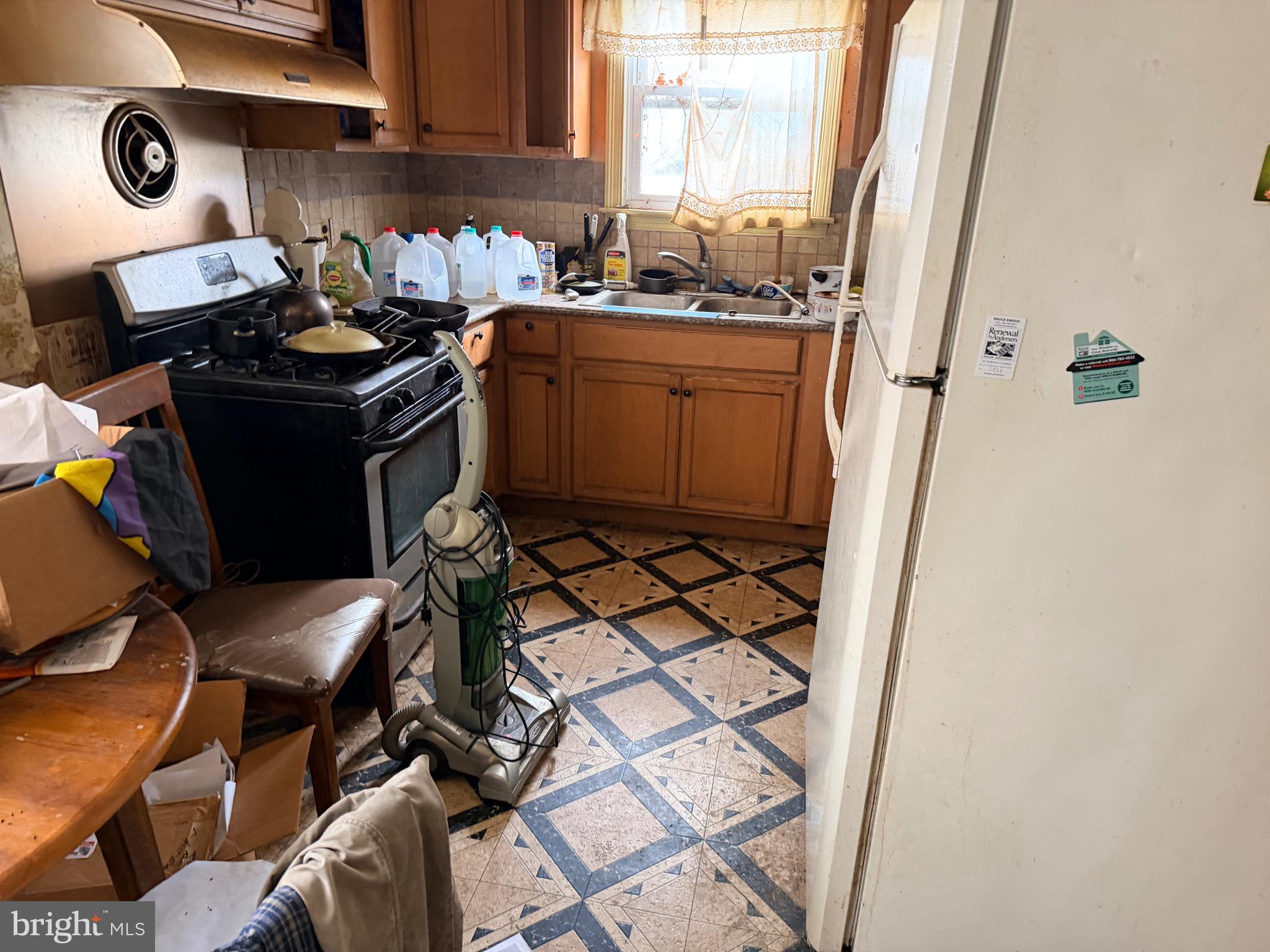 132 Oakdale Road Cherry Hill, NJ 08034 - Photo 6 of 18 a kitchen with a sink appliances and cabinets