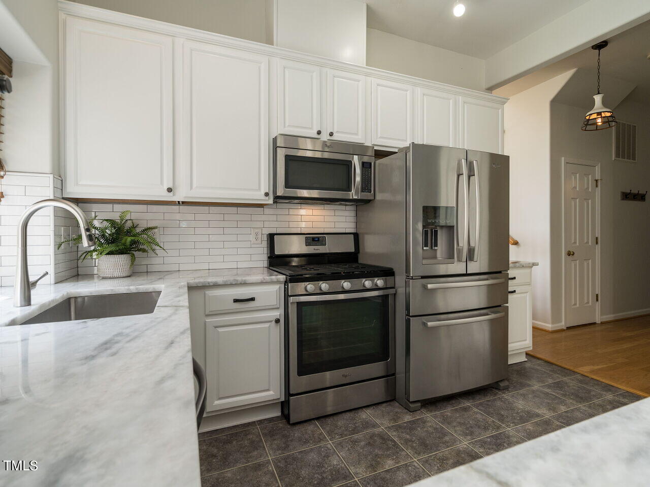 16 Richardson Circle Durham, NC 27713 - Photo 12 of 35 a kitchen with stainless steel appliances granite countertop a refrigerator stove and sink