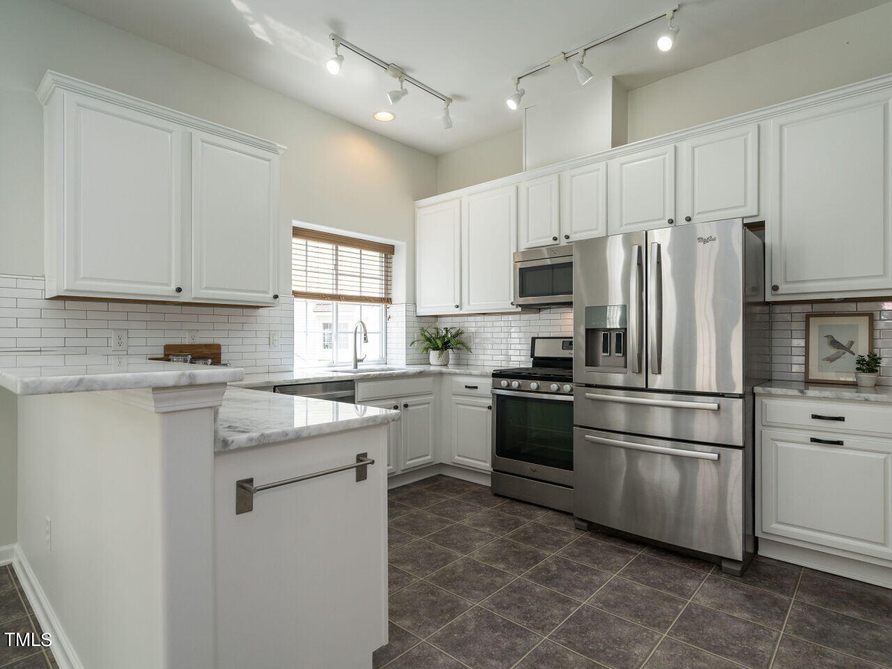 16 Richardson Circle Durham, NC 27713 - Photo 13 of 35 a kitchen with granite countertop white cabinets and stainless steel appliances