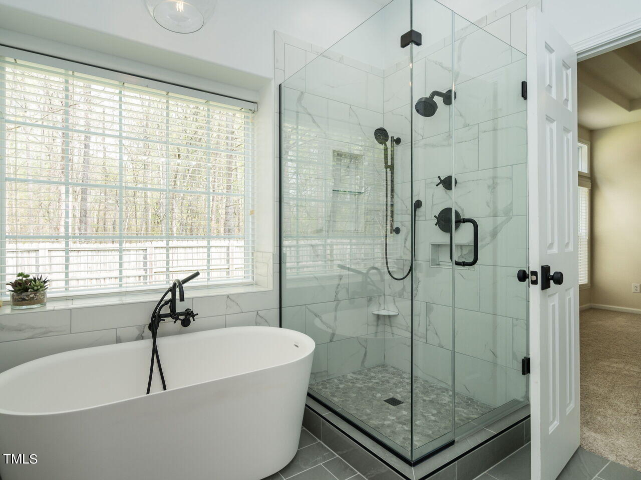 16 Richardson Circle Durham, NC 27713 - Photo 18 of 35 a bathroom with a shower and window