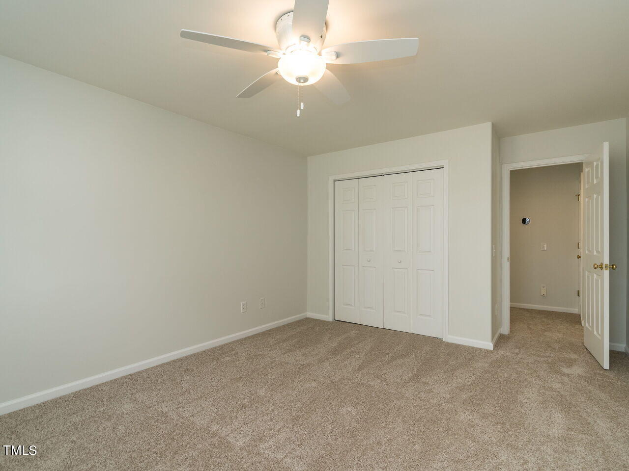 16 Richardson Circle Durham, NC 27713 - Photo 21 of 35 an empty room with a ceiling fan and a window