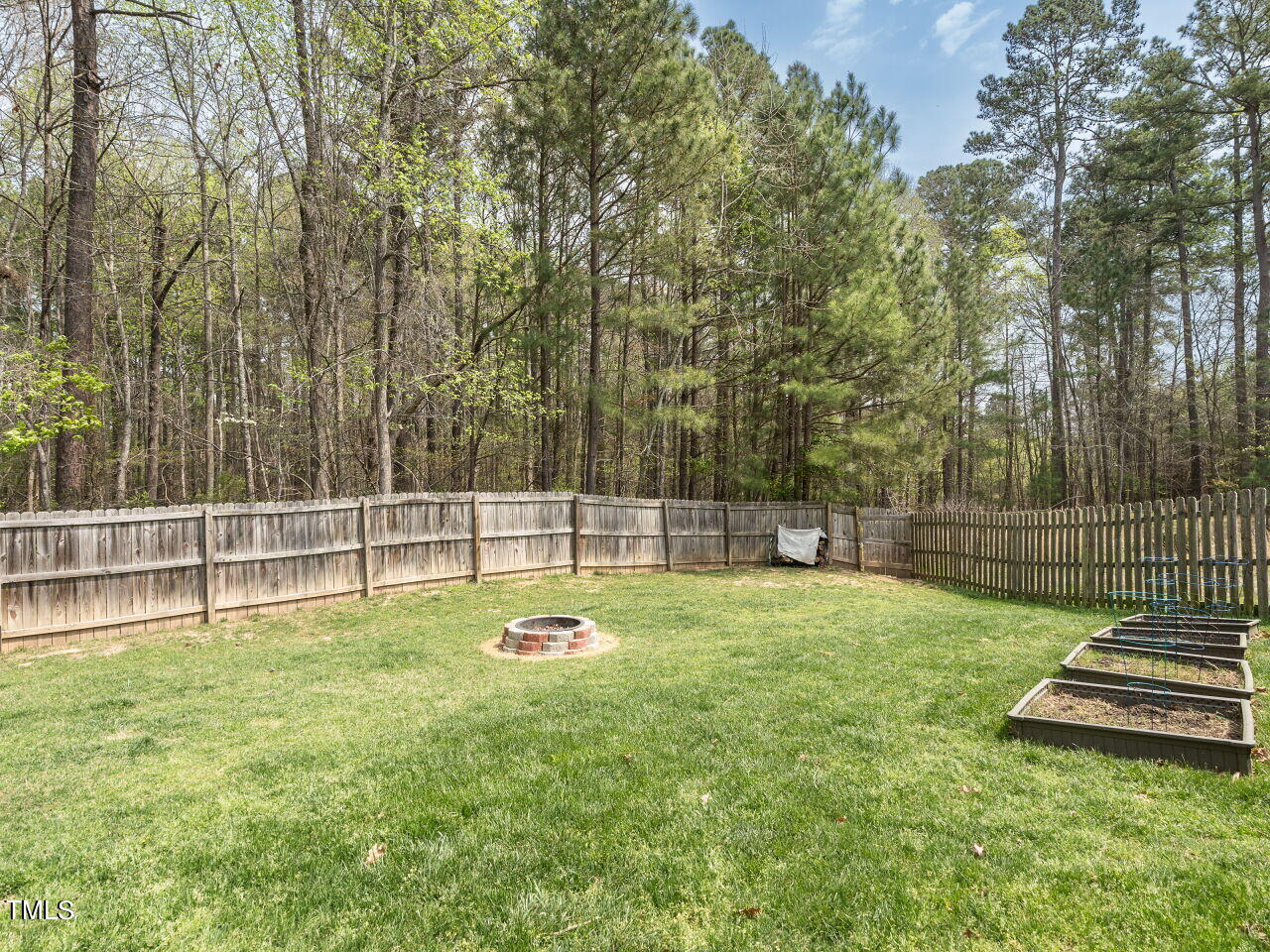 16 Richardson Circle Durham, NC 27713 - Photo 26 of 35 a view of a backyard with swings