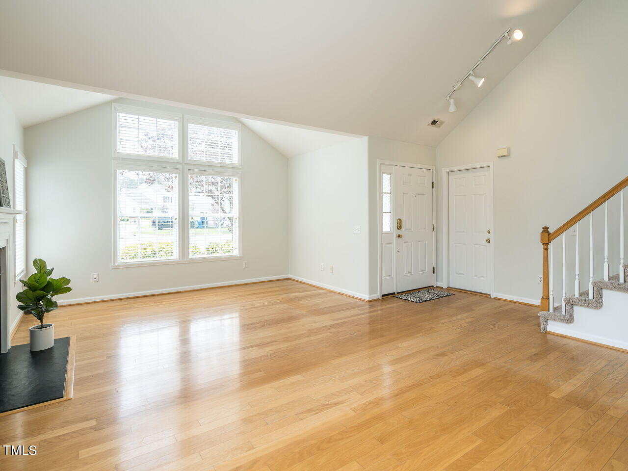 16 Richardson Circle Durham, NC 27713 - Photo 6 of 35 a view of an empty room with a window and wooden floor