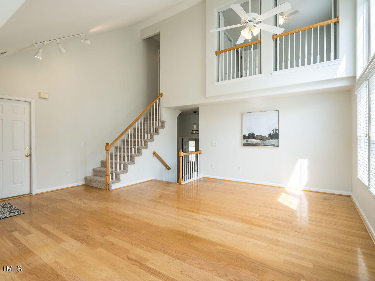 16 Richardson Circle Durham, NC 27713 - Photo 7 of 35 a view of an empty room with stairs and a window