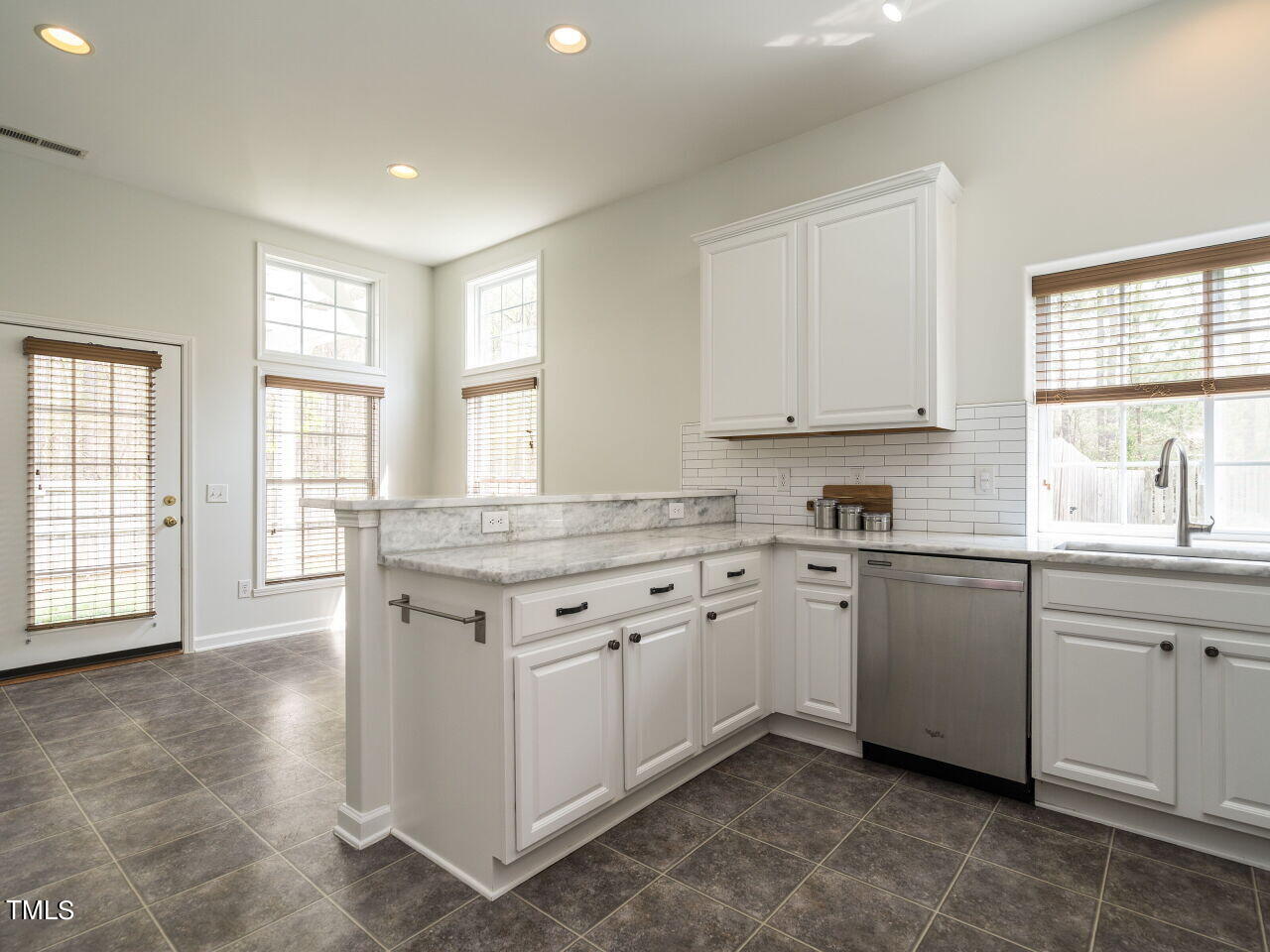 16 Richardson Circle Durham, NC 27713 - Photo 9 of 35 a kitchen with granite countertop cabinets stainless steel appliances a sink and a window