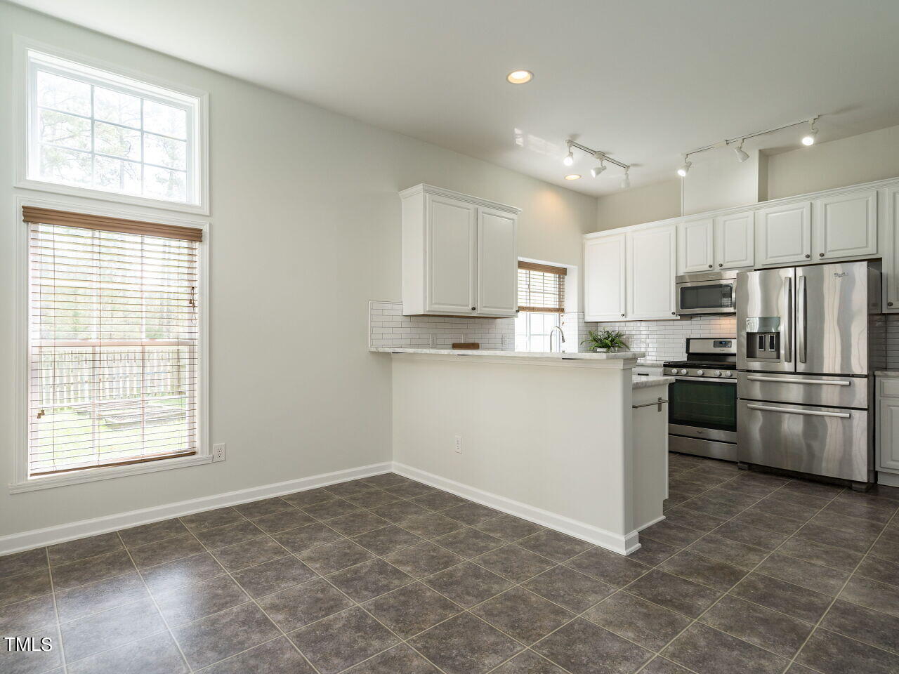 16 Richardson Circle Durham, NC 27713 - Photo 10 of 35 a kitchen with a refrigerator and a stove top oven