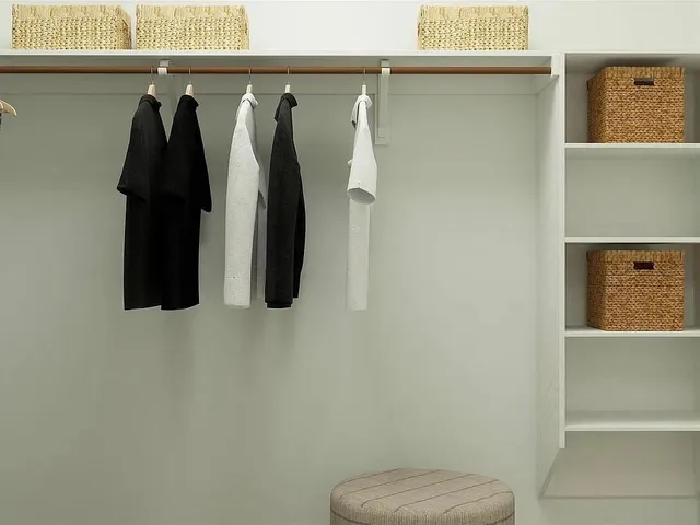 a bedroom with a bed and painting on the wall