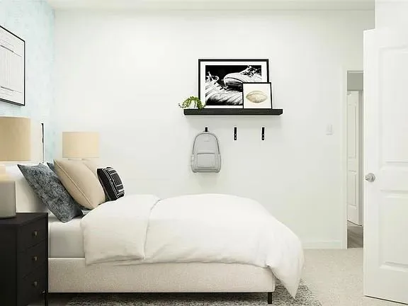 a bedroom with a bed and a mirror