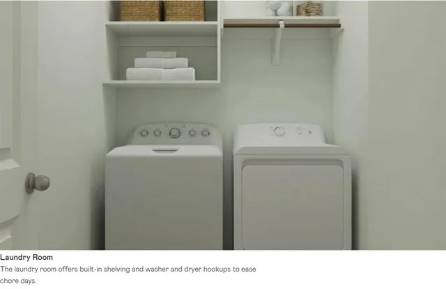 a living room with a large window and a potted plant