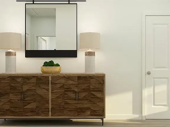 a picture of a bench in front of a wall