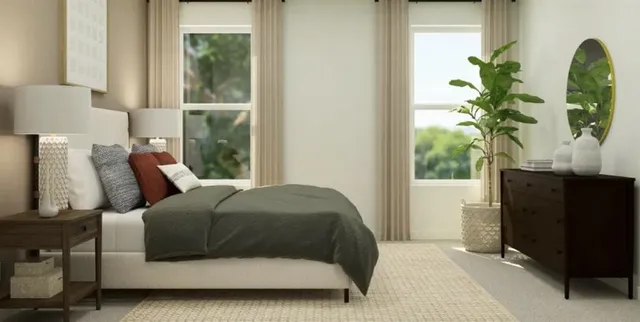 a large white bed sitting in a bathroom next to a window