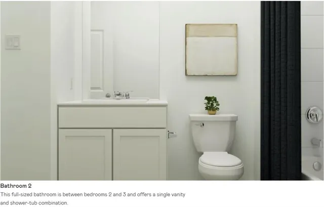 a bedroom with a bed and a night stand