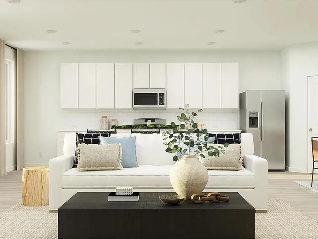a dining room with furniture and wooden floor