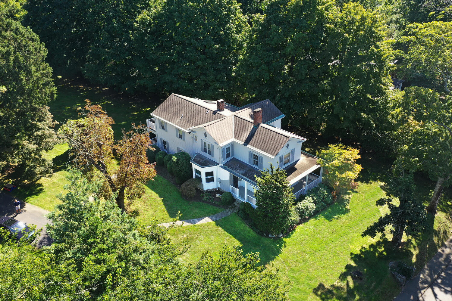 an aerial view of a house with yard swimming pool and outdoor seating