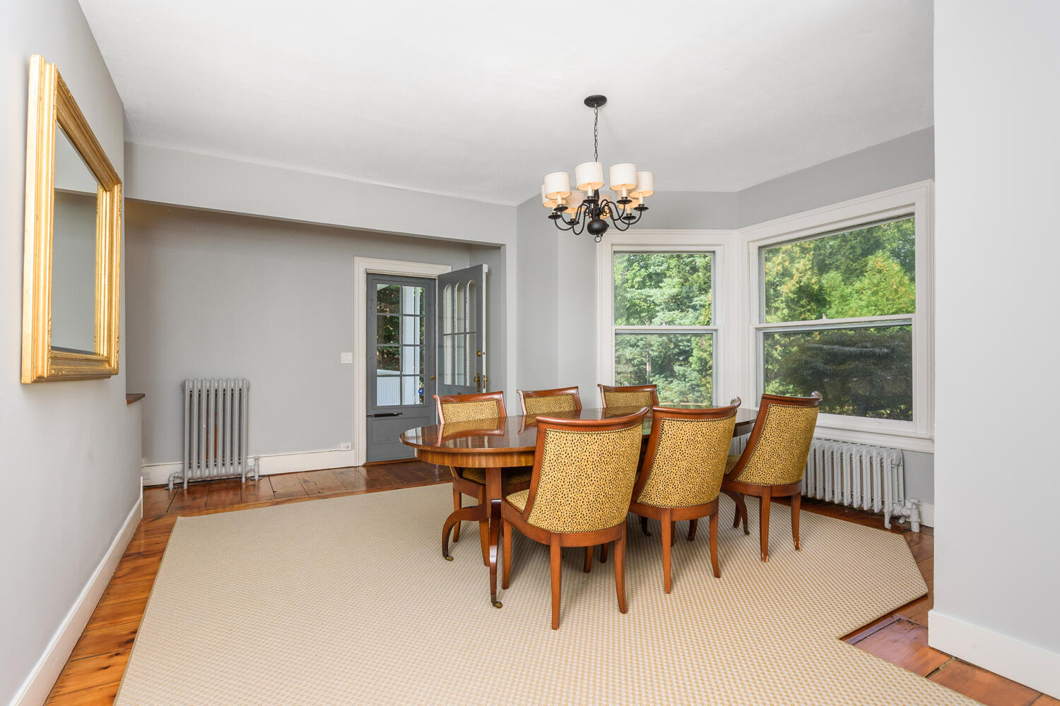 44 Brookside Road Darien, CT 06820 - Photo 16 of 36 a view of a dining room with furniture wooden floor and chandelier