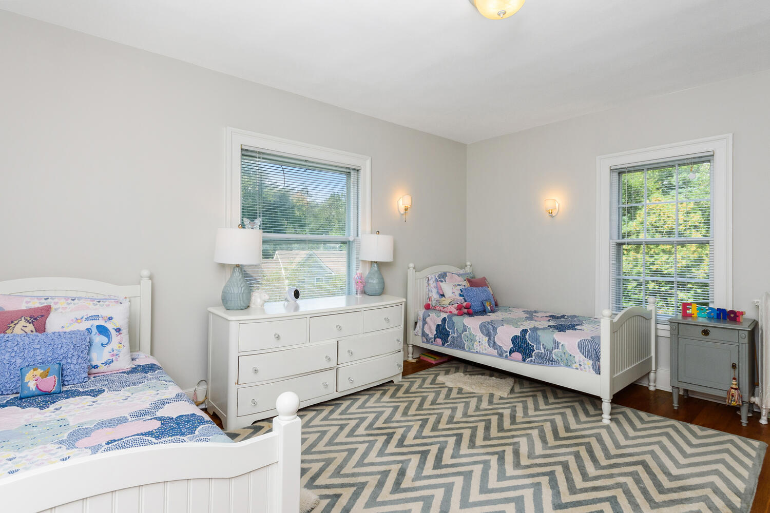 44 Brookside Road Darien, CT 06820 - Photo 26 of 36 a room with a baby bed a couch and dresser