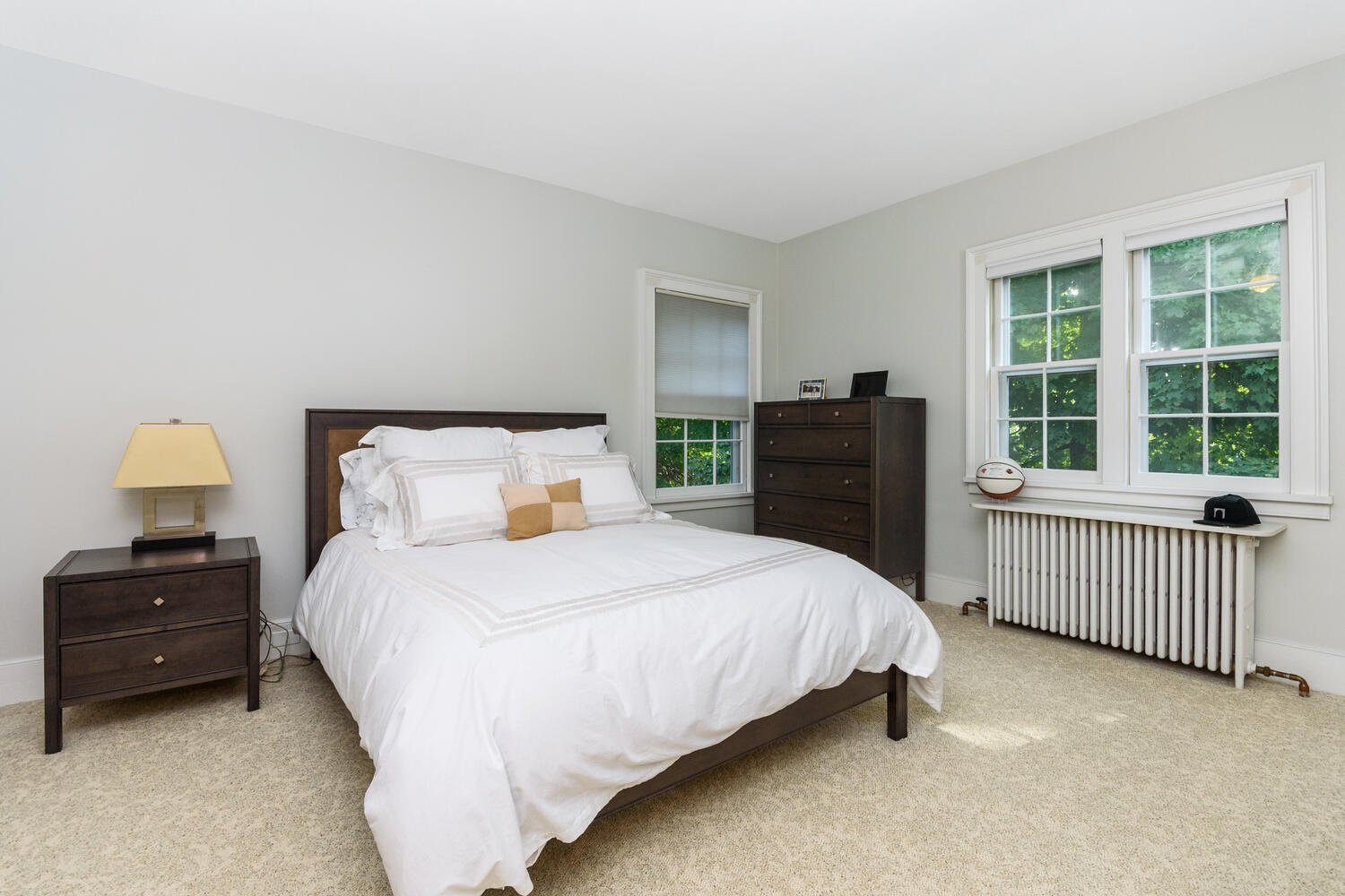 44 Brookside Road Darien, CT 06820 - Photo 27 of 36 a bedroom with a bed and wooden floor