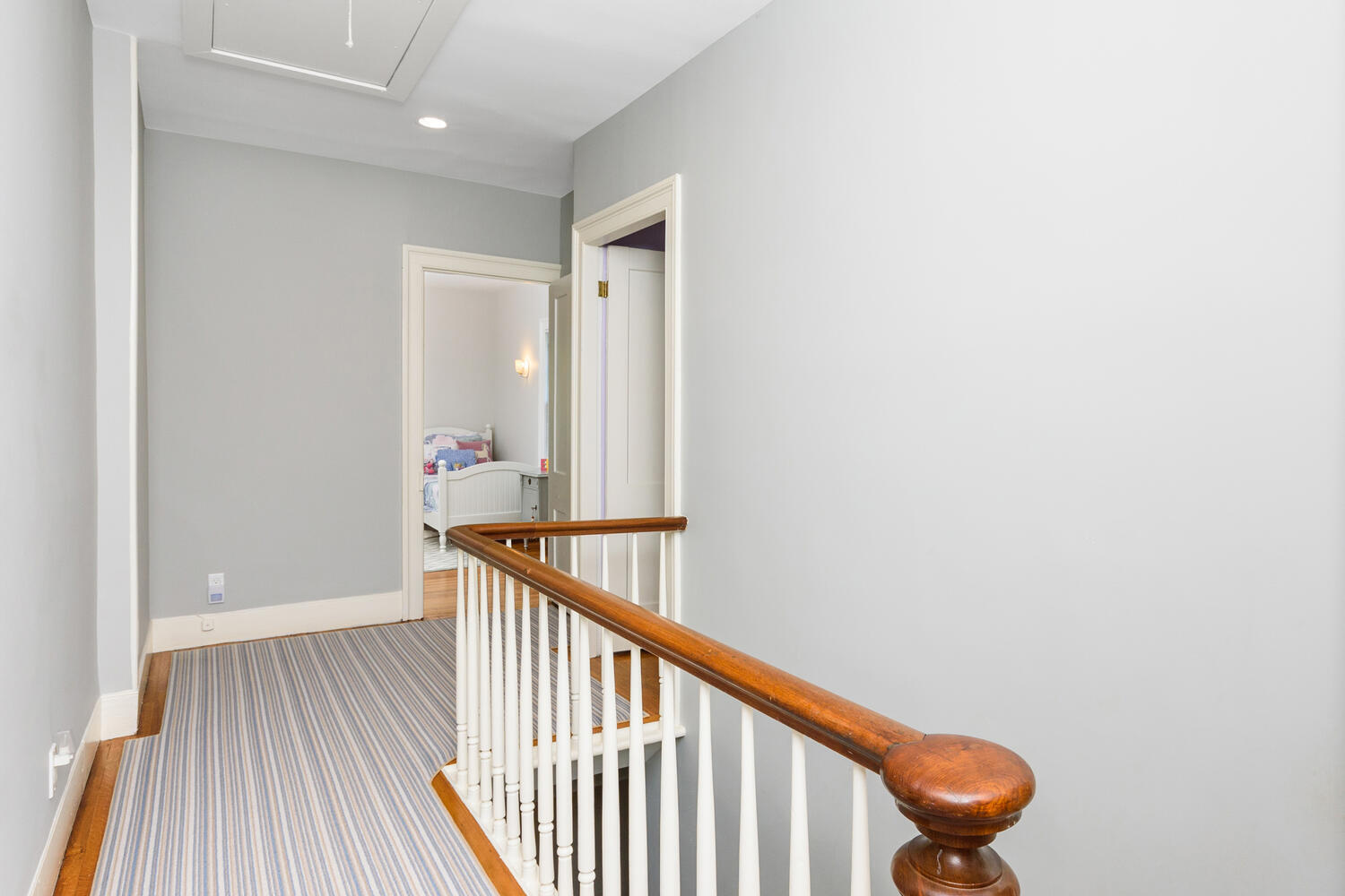 44 Brookside Road Darien, CT 06820 - Photo 29 of 36 a view of a hallway with wooden floor and stairs