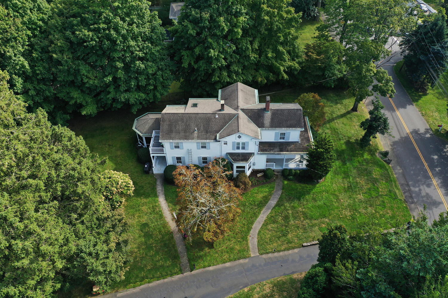 44 Brookside Road Darien, CT 06820 - Photo 34 of 36 an aerial view of a house with a yard