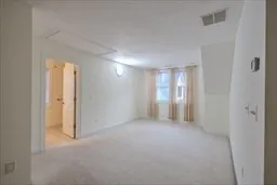 a view of empty room with windows