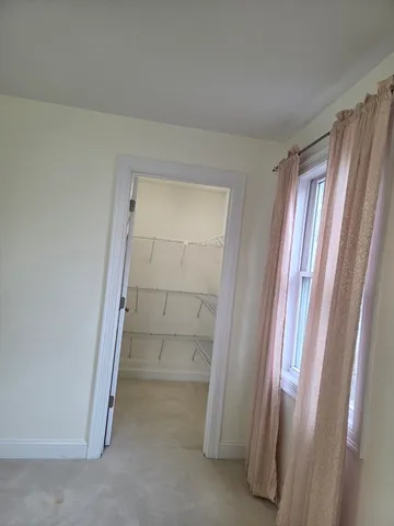 a bathroom with a bath tub with a shower