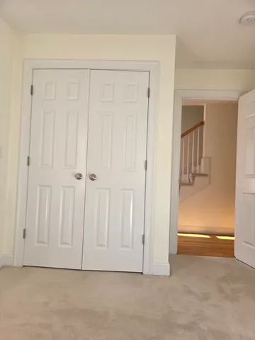 an empty room with a mirror