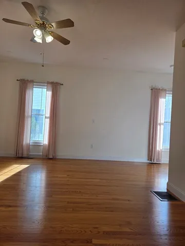 a kitchen with stainless steel appliances granite countertop a stove a sink dishwasher and a microwave oven with wooden floor