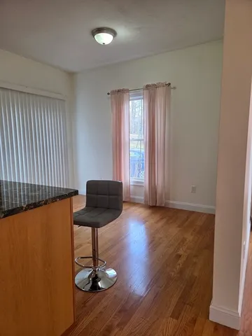 a view of entryway with wooden floor