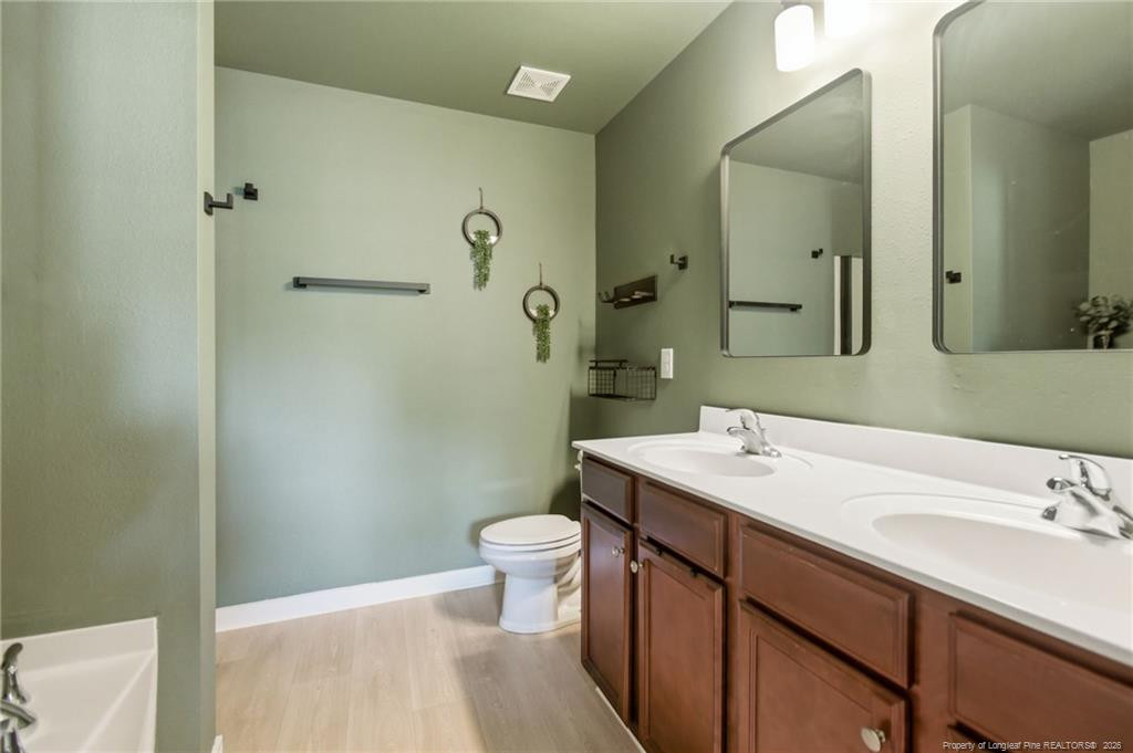 334 Crane Way Bunnlevel, NC 28323 - Photo 31 of 45 a bathroom with a sink toilet and shower