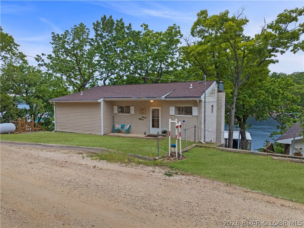 29966 Oak Knoll Road Rocky Mount, MO 65072 - Photo 36 of 68 View of home from the roadside. Gravel parking are