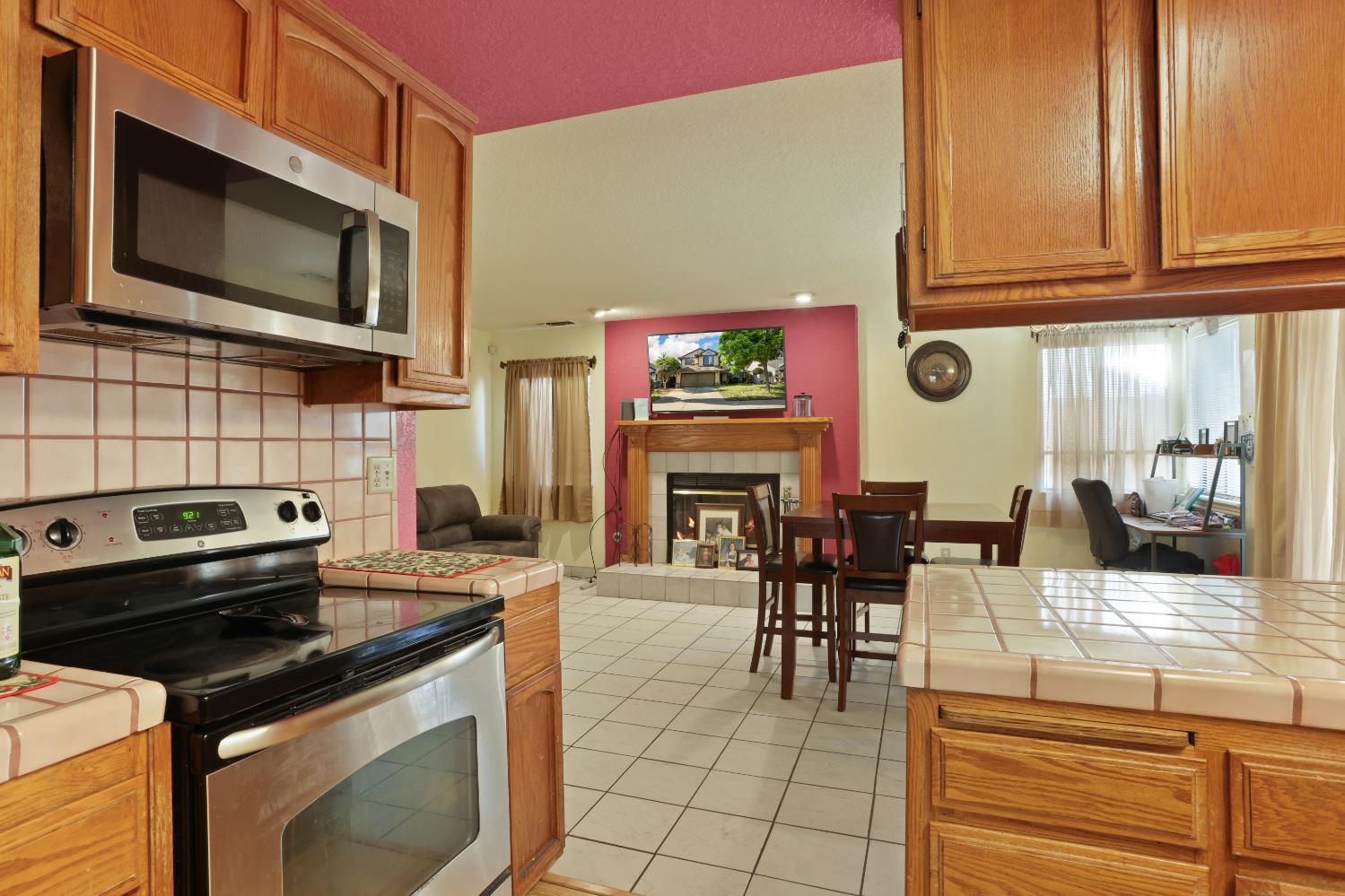 2008 Sheldon Drive Modesto, CA 95350 - Photo 13 of 39 a kitchen with granite countertop a stove top oven microwave and cabinets
