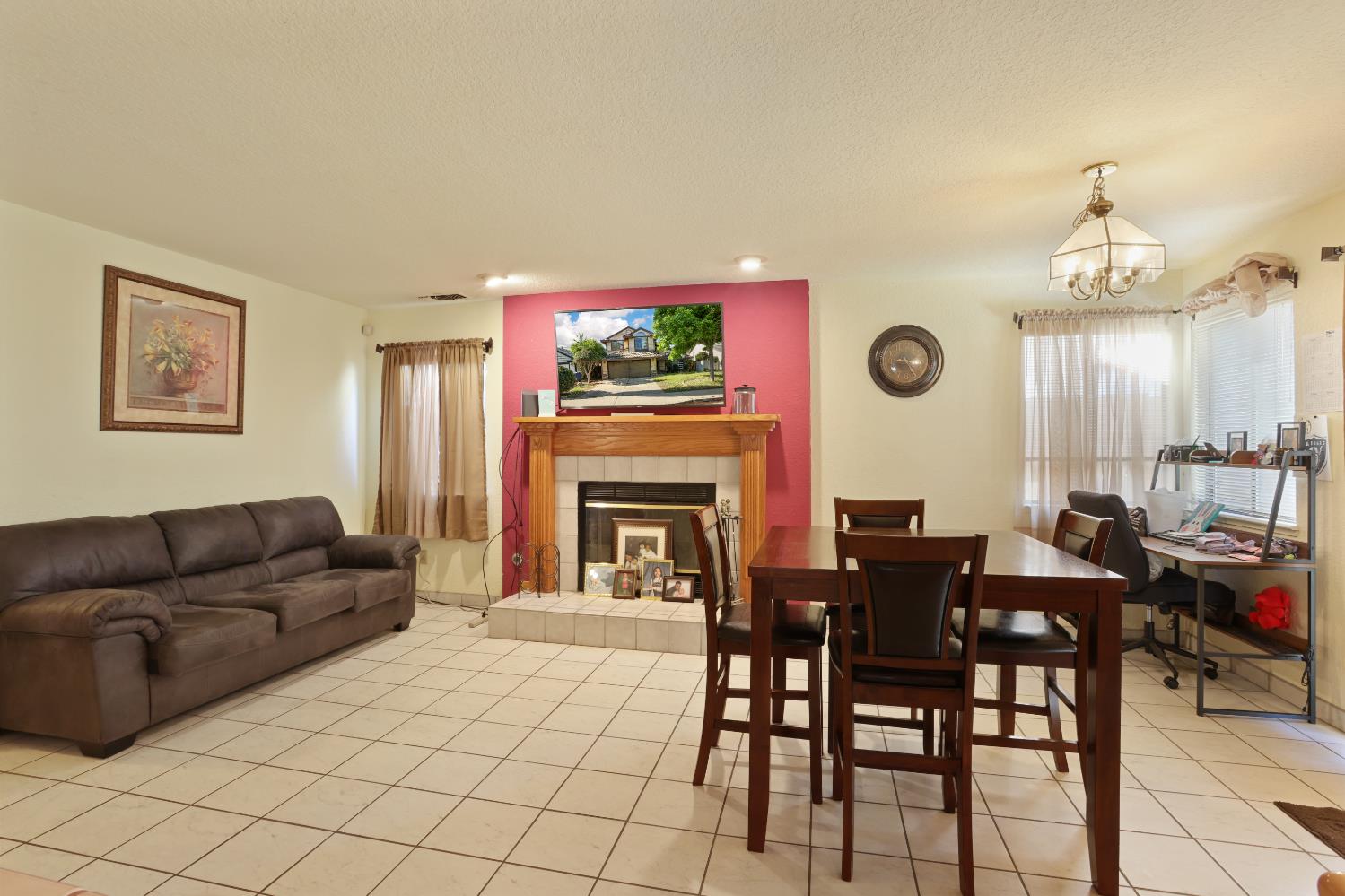 2008 Sheldon Drive Modesto, CA 95350 - Photo 14 of 39 a living room with furniture a fireplace and a table with wooden floor