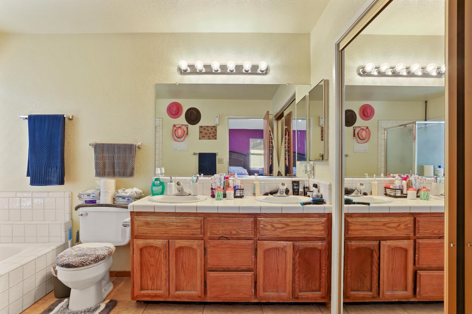2008 Sheldon Drive Modesto, CA 95350 - Photo 25 of 39 a bathroom with a sink vanity mirror and toilet