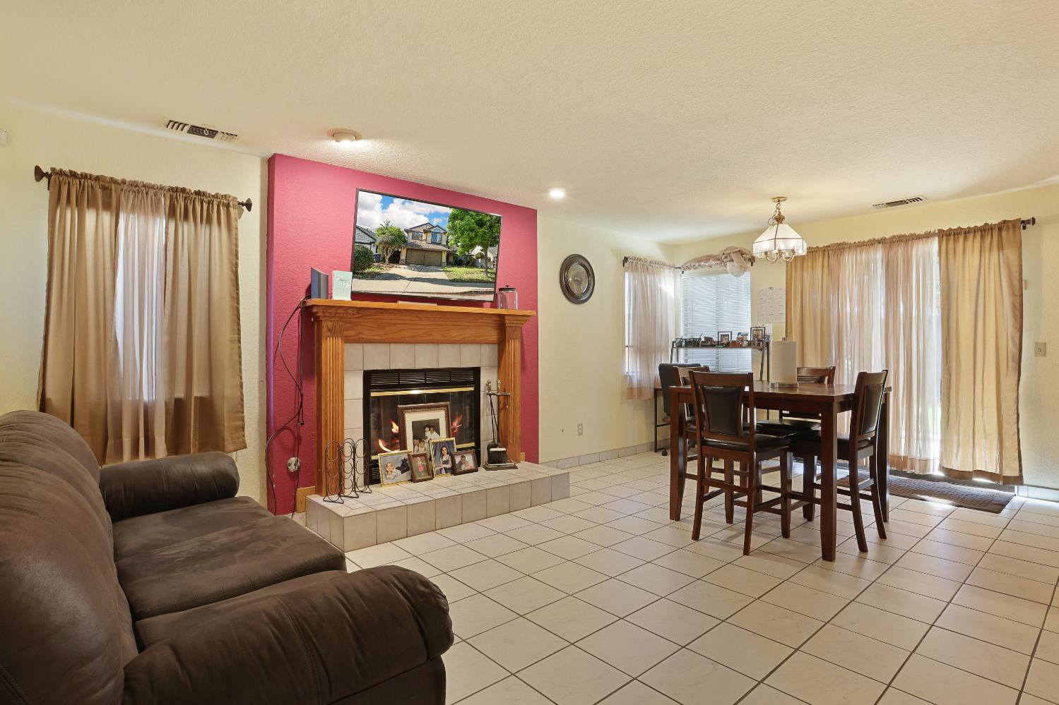 2008 Sheldon Drive Modesto, CA 95350 - Photo 7 of 39 a living room with furniture a fireplace and a dining table