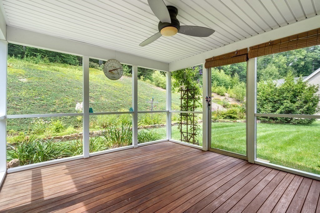 8 Reed Lane, Unit 8 Littleton, MA 01460 - Photo 17 of 37 a bedroom with large windows and wooden floor