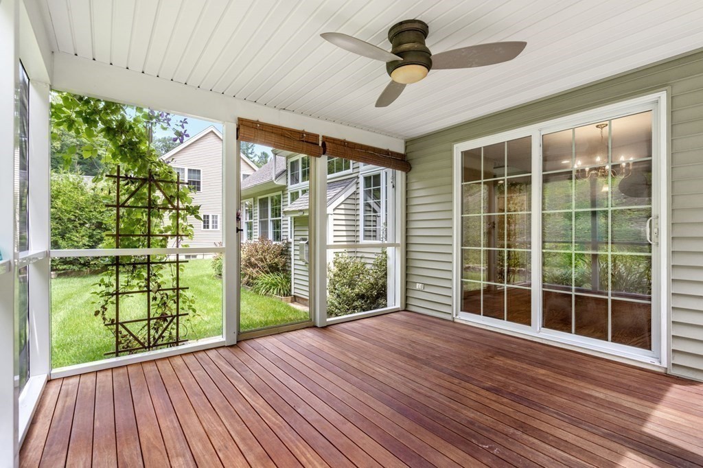8 Reed Lane, Unit 8 Littleton, MA 01460 - Photo 18 of 37 a view of a porch with wooden floor and windows