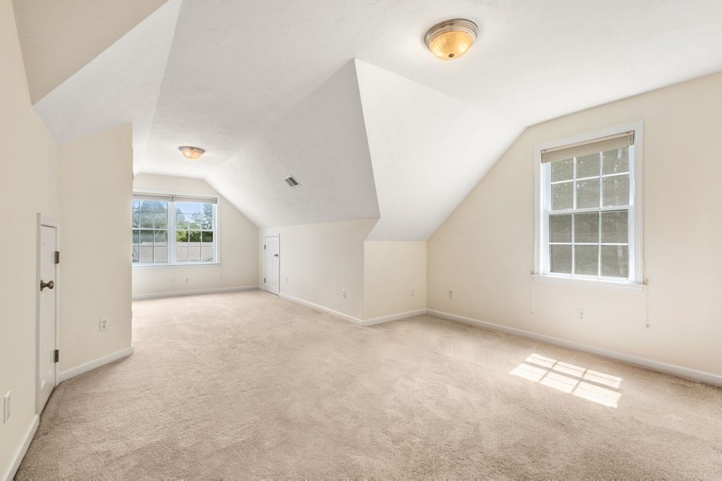 8 Reed Lane, Unit 8 Littleton, MA 01460 - Photo 25 of 37 an empty room with windows
