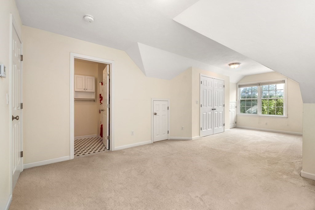 8 Reed Lane, Unit 8 Littleton, MA 01460 - Photo 26 of 37 an empty room with windows and closet