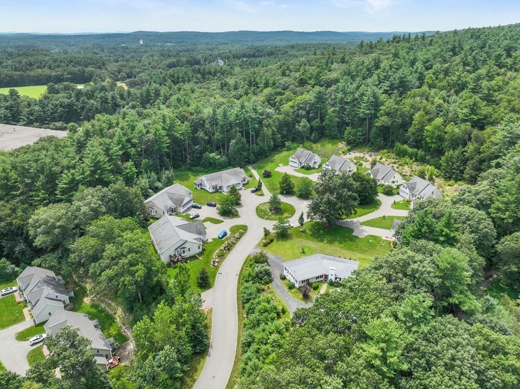 8 Reed Lane, Unit 8 Littleton, MA 01460 - Photo 3 of 37 an aerial view of a house with a yard