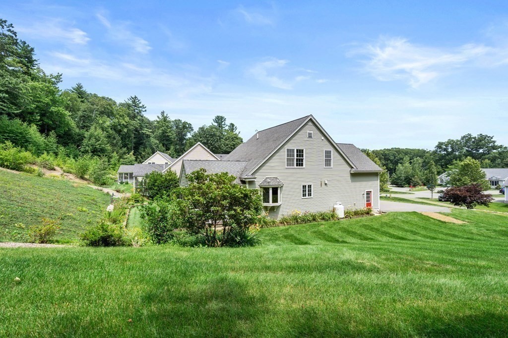 8 Reed Lane, Unit 8 Littleton, MA 01460 - Photo 32 of 37 a house view with a garden space